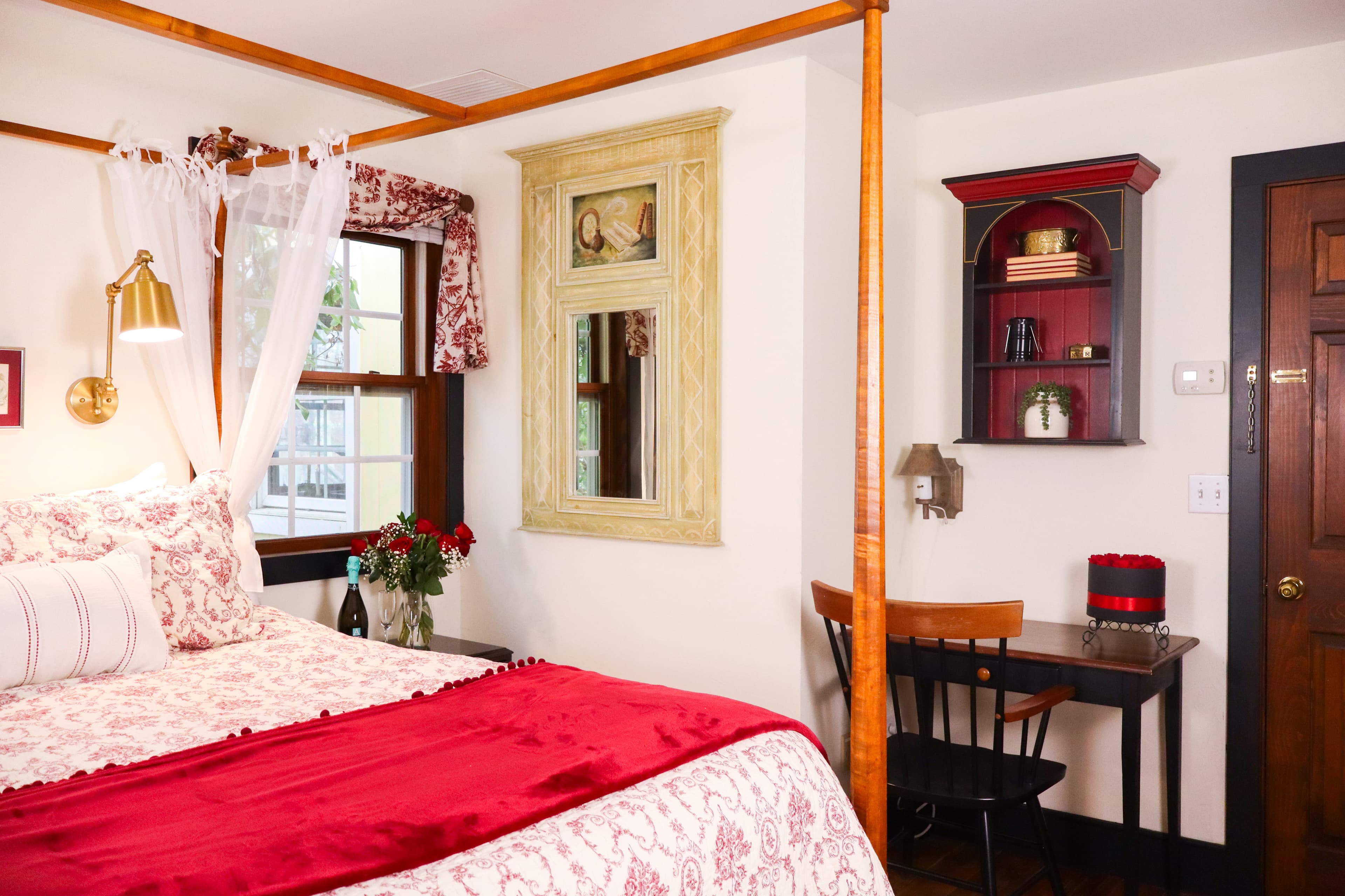 French doors open from an indoor seating area onto a private deck with lounge chairs.