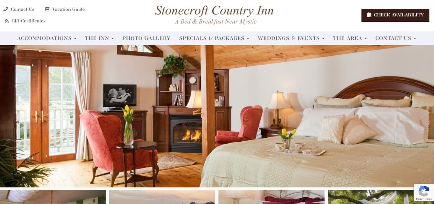 Interior of Stonecroft Country Inn featuring a cozy bedroom with a fireplace and seating area. Interior of Stonecroft Country Inn featuring a cozy bedroom with a fireplace and seating area.