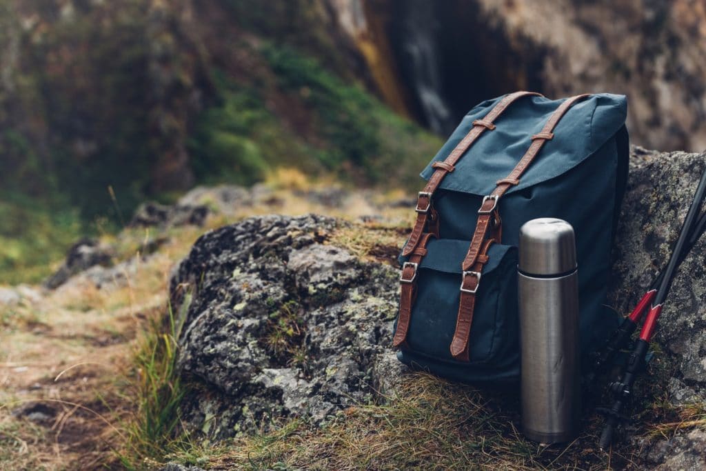 Hipster Blue Backpack, Thermos And Trekking Poles Closeup, Front View | Lantern Hill in Ledyard, CT
