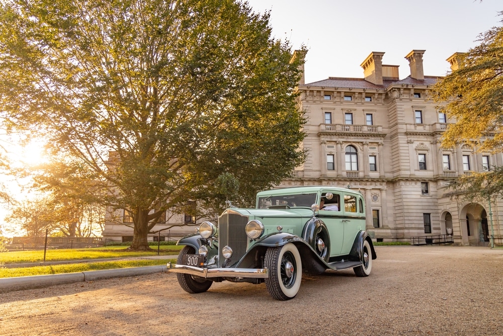 Newport Mansions, photo of a classic car in front of the breakers mansion in Newport, RI