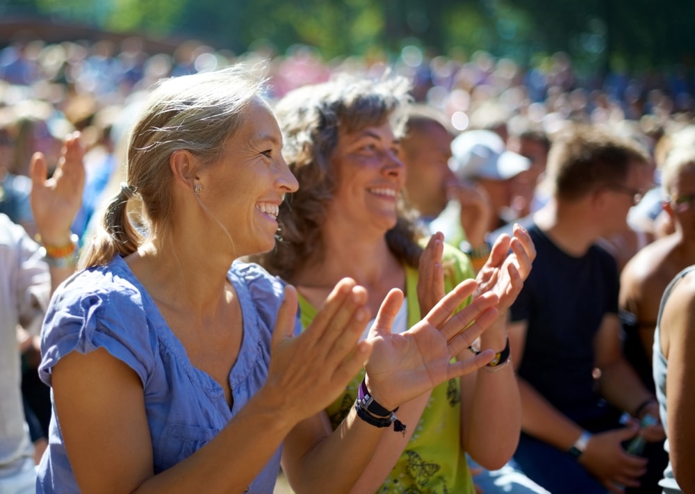 Festivals in CT, two women enjoying a summer concert in Mystic